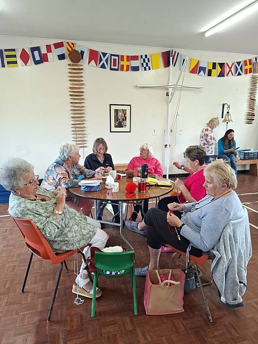 A group of people making things together around a table