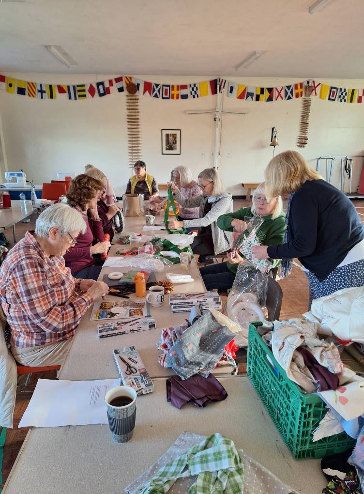 Bright reels of thread, scissors and a tape measure